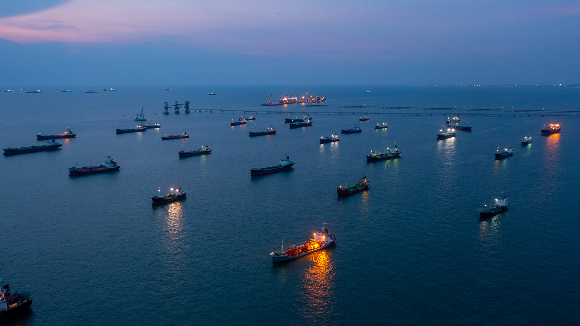 Aerial view Oil and Gas tanker ship LPG tanker ship transportation oil and gas from refinery on the sea at night, Oil and Gas tanker ship global business logistic refinerytransportation.